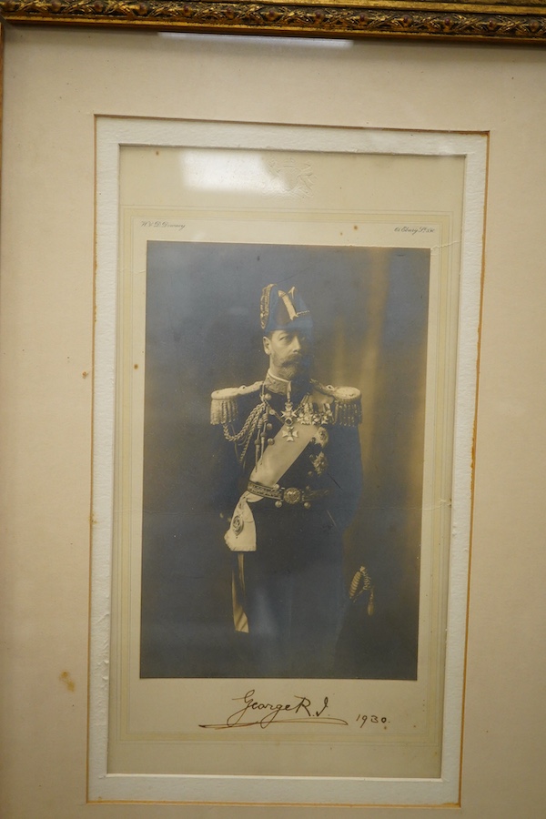 A pair of framed photographs of King George V and Queen Mary, signed by each on the Mount beneath the photograph, and both dated 1930, contained within a gilt frame, overall dimensions 50.5 x 61cm